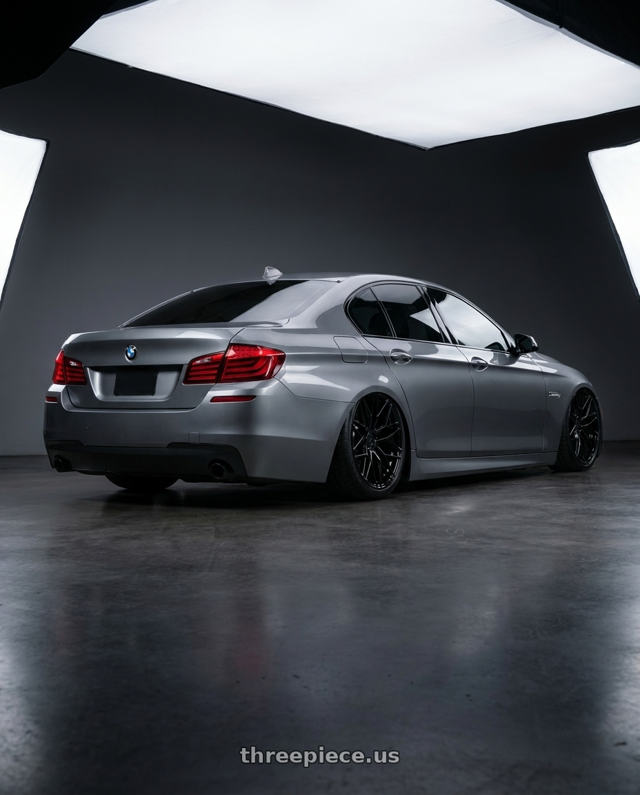 2016 BMW 5 Series F10 with Avant Garde Wheels M520R 5X120 20x11 +45 Gloss Black wheels rear three quarter view slight stretch tires