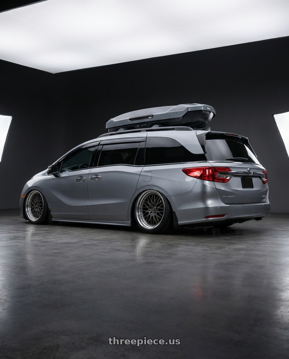2024 Honda Odyssey with Work Vs-Xv 5x120 20x7.5+34 A Disk Matte Dark Gunmetal wheels rear three quarter view extreme stretch tires