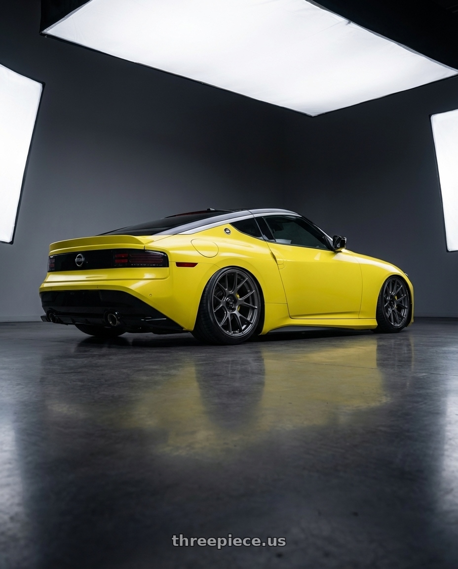 2024 Nissan Z with Konig Ampliform 5x114.3 19x10.5+23 Dark Metallic Graphite wheels rear three quarter view slight stretch tires