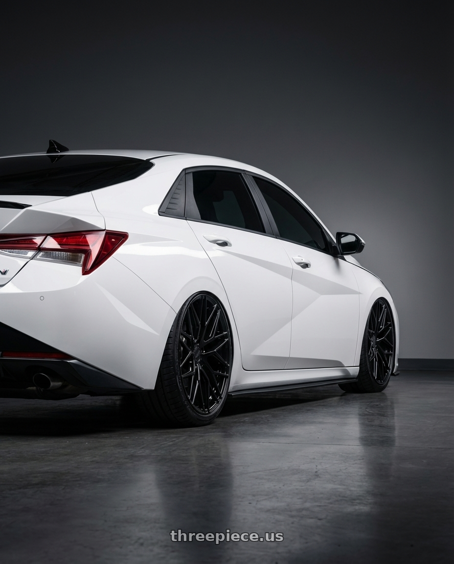 2024 Hyundai Elantra N with Avant Garde Wheels M520R 5X114.3 19x8.5 +35 Gloss Black wheels rear three quarter view slight stretch tires