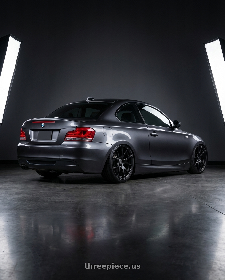 2012 BMW 1 Series E82 with Forgestar CF5V 5x120 19x9 +38 Satin Black wheels rear three quarter view slight stretch tires