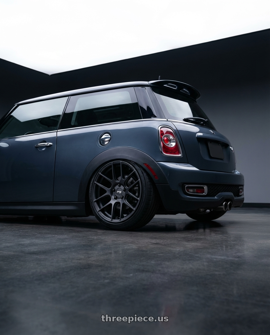 2010 Mini Cooper S R56 with Niche 1PC M106 NR6 4X100/4X108 17X7.5 +45 MATTE BLACK MILLED wheels rear three quarter view slight stretch tires