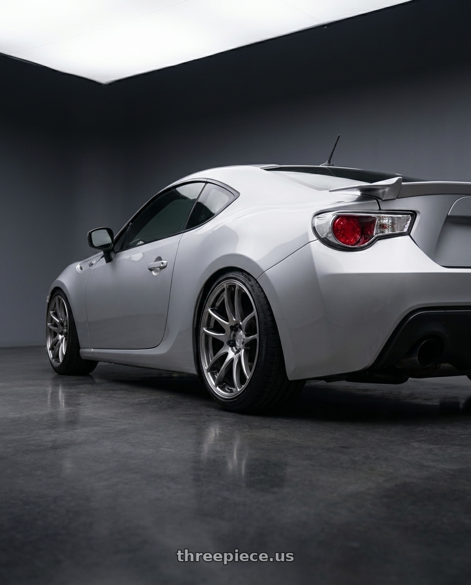 2012 Toyota GT86 Sterling Silver with Work Emotion Cr Kiwami 5x100 18x7.5 +38 Gt Silver wheels rear three quarter view slight stretch tires