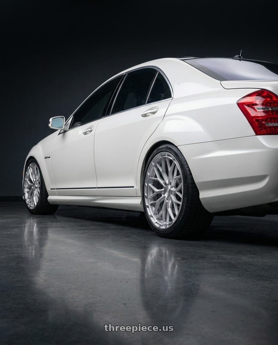 2009 Mercedes s63 with DOLCE PERFORMANCE MAGARI 5x112 20x10.5 +40 Gloss Silver wheels rear three quarter view square tires