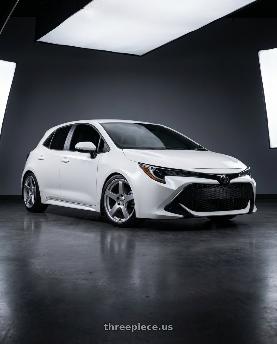 2023 Toyota Corolla Hatchback with Ssr Gtv01 5x114.3 18x10.5+15  GLARE SILVER wheels front three quarter view lowered stance