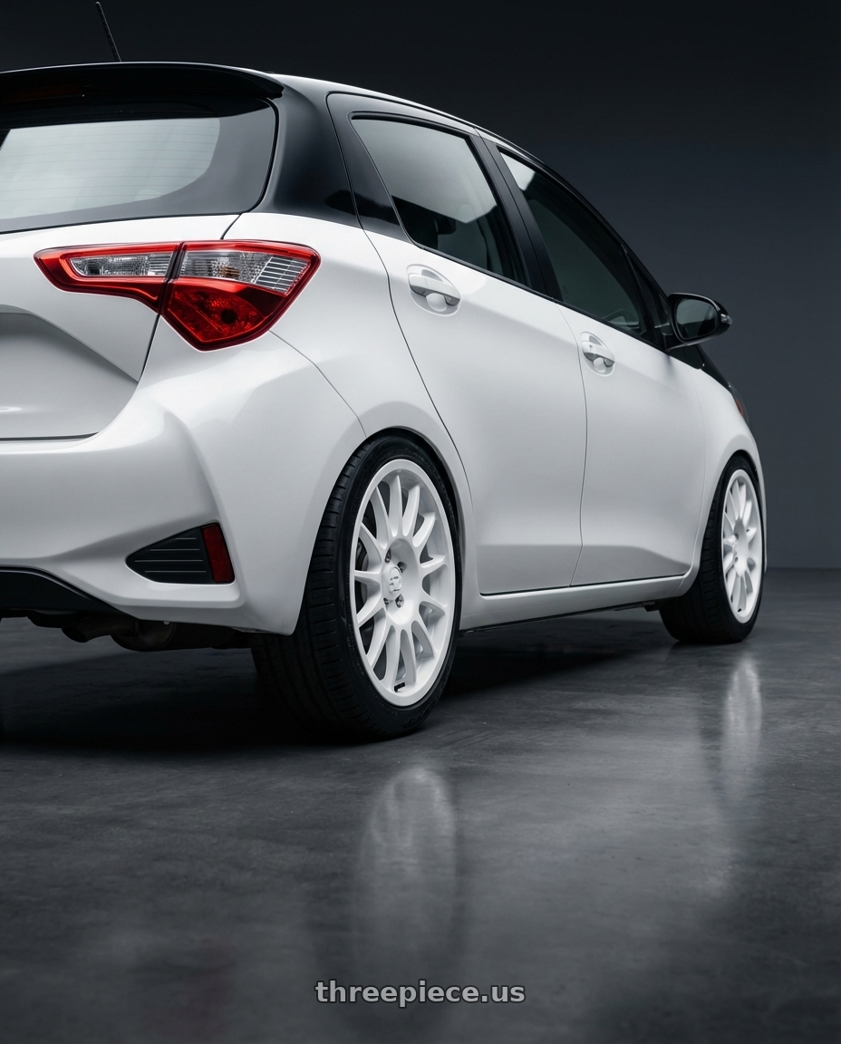 2020 Toyota Yaris Y20 with fifteen52 PODIUM 5x100 / 5x112 17x7.5 +35 RALLY WHITE (GLOSS WHITE) wheels rear three quarter view square tires