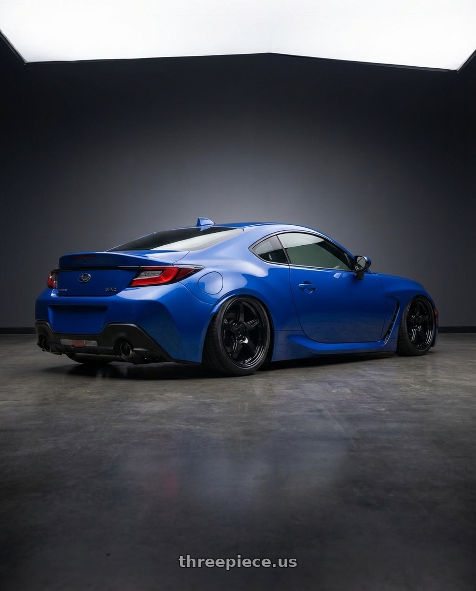 2024 Subaru BRZ with Gram Lights 57CR 5x114.3 18x9.5+38 Glossy Black wheels rear three quarter view slight stretch tires