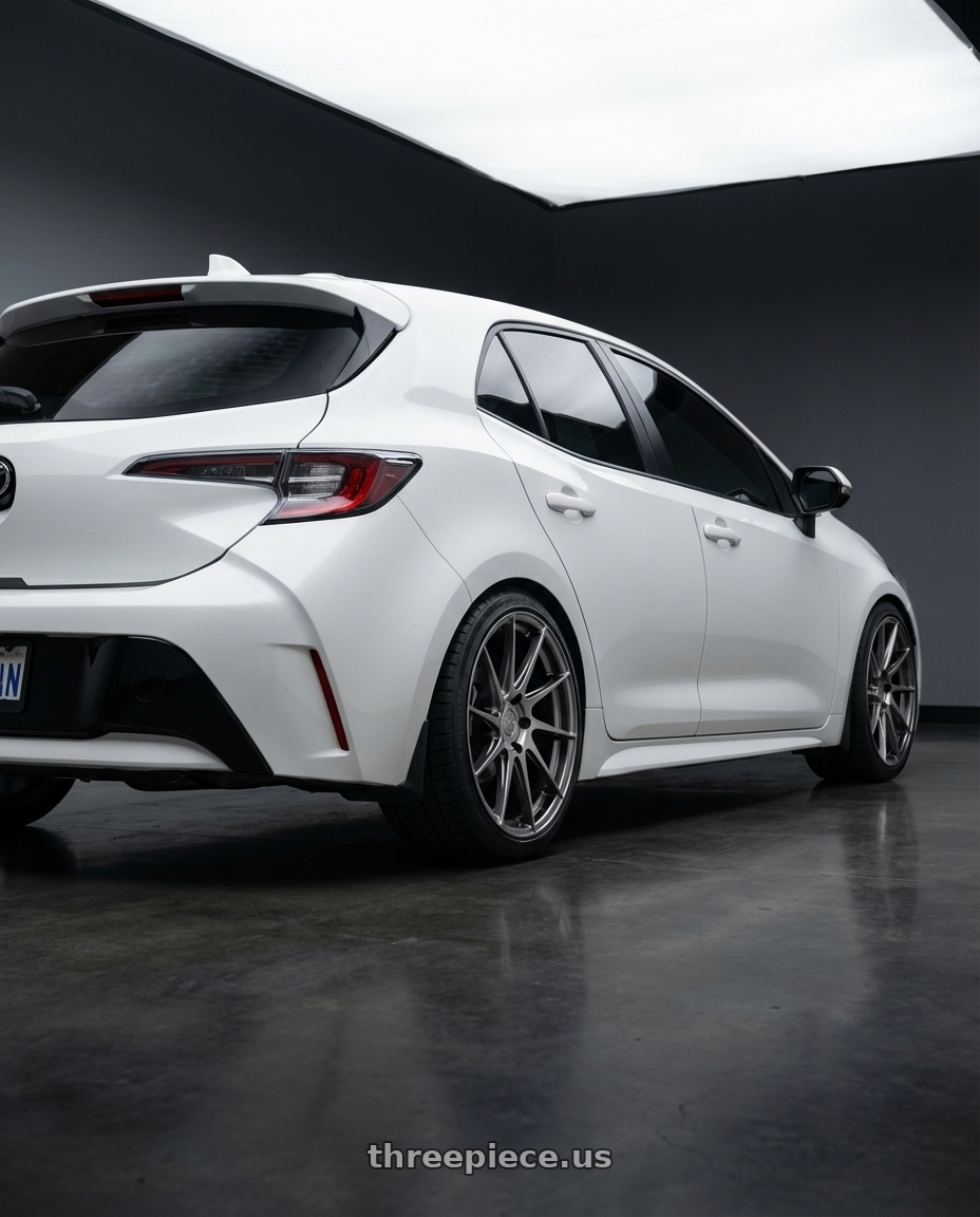 2023 Toyota Corolla Hatchback with Aodhan AH09 5x114.3 18x8.5 +35 Hyper Black wheels rear three quarter view square tires