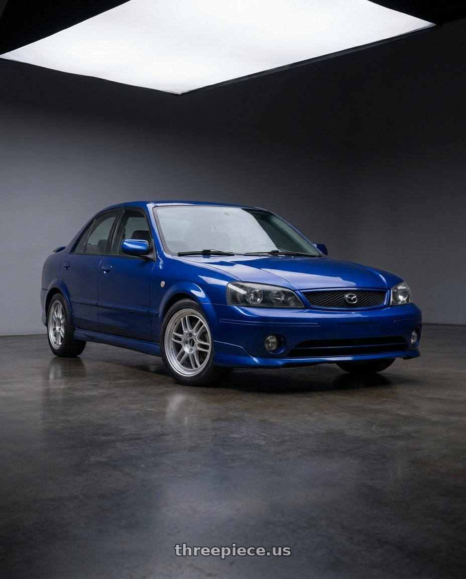 2003 Mazda Protege ES with Enkei RPF1 5x114.3 16x7+43 Silver wheels front three quarter view stock stance
