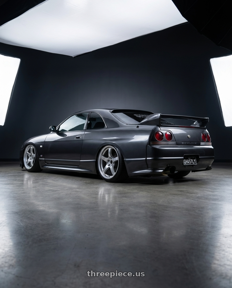 1996 Nissan Skyline R33 GTST with Gram Lights 57CR 5x114.3 18x9.5+38 Grace Silver wheels rear three quarter view extreme stretch tires