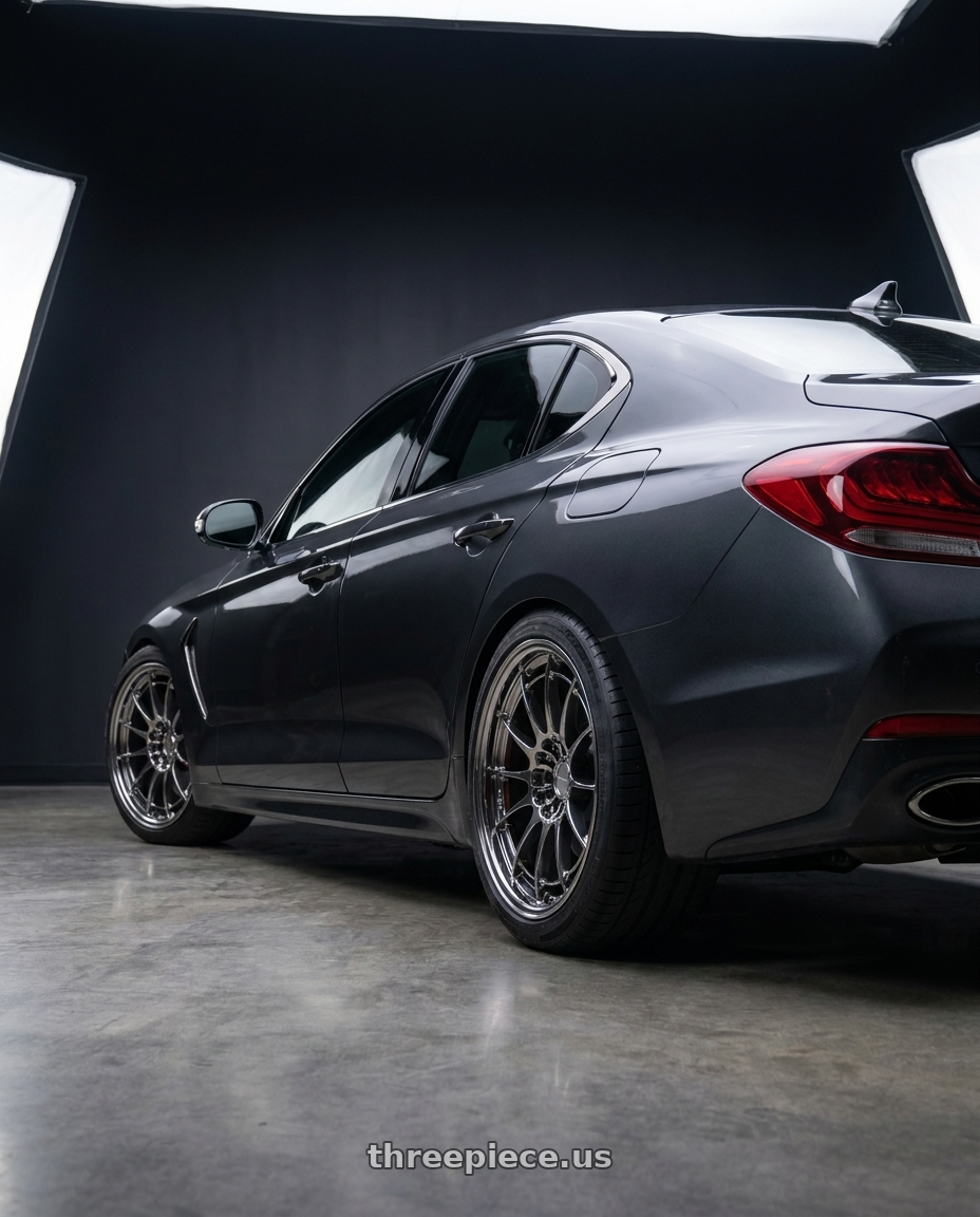 2019 Genesis G70 with Enkei NT03+M 5x114.3 18x9.5+27 SBC wheels rear three quarter view slight stretch tires