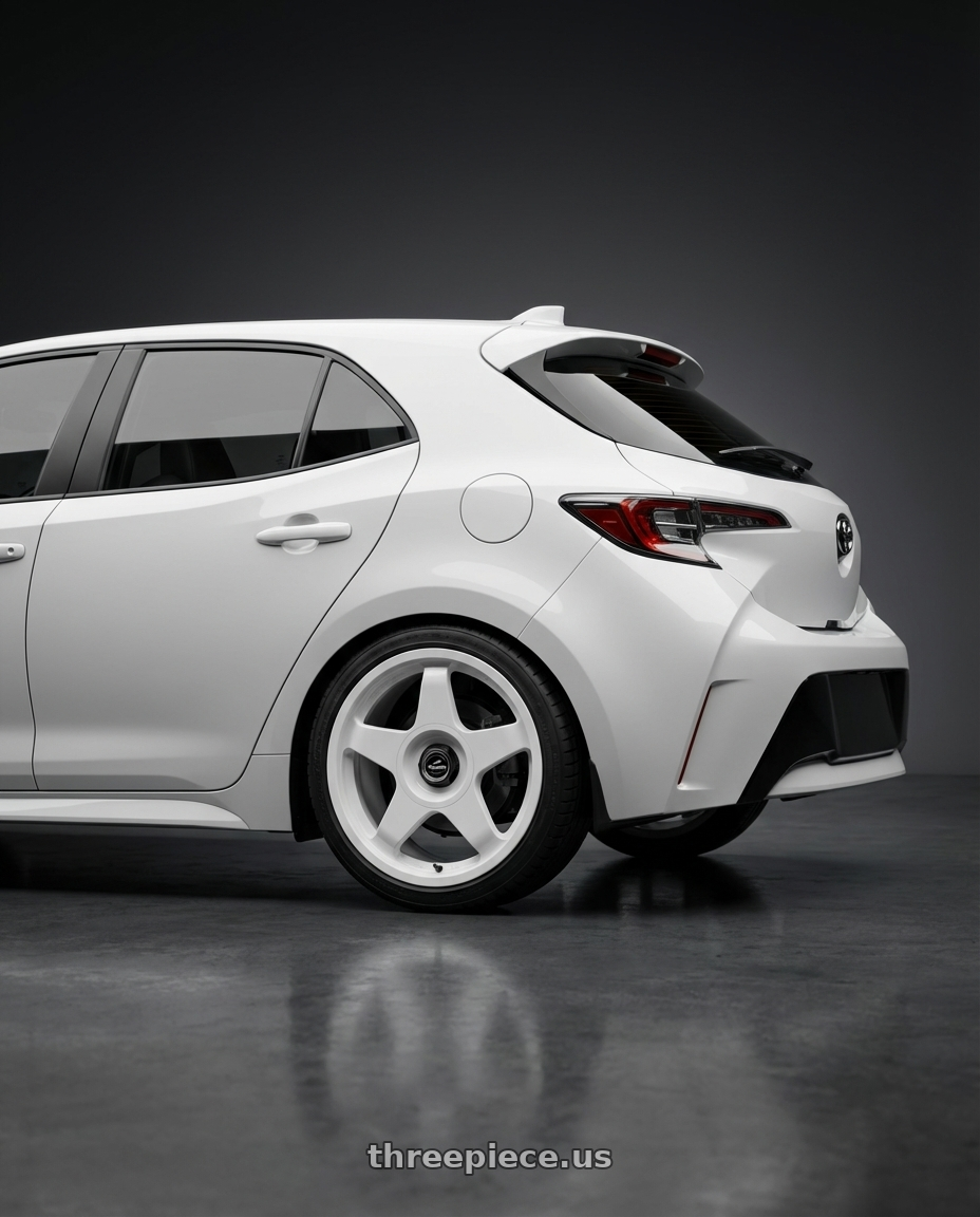2023 Toyota Corolla Hatchback with fifteen52 CHICANE 5x114.3 / 5x100 18x8.5 +35 RALLY WHITE (GLOSS WHITE) wheels rear three quarter view square tires