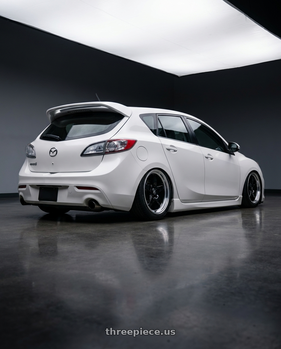 2012 Mazda Mazdaspeed3 with Forgestar D5 Drag 5x114.3 18x10 +42 Gloss Black Machined wheels rear three quarter view slight stretch tires