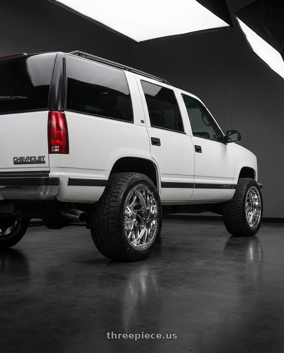 1995 chevrolet Tahoe with Fuel 2PC D210 TRITON 8X165.1 22X14 -70 CHROME PLATED wheels rear three quarter view square tires