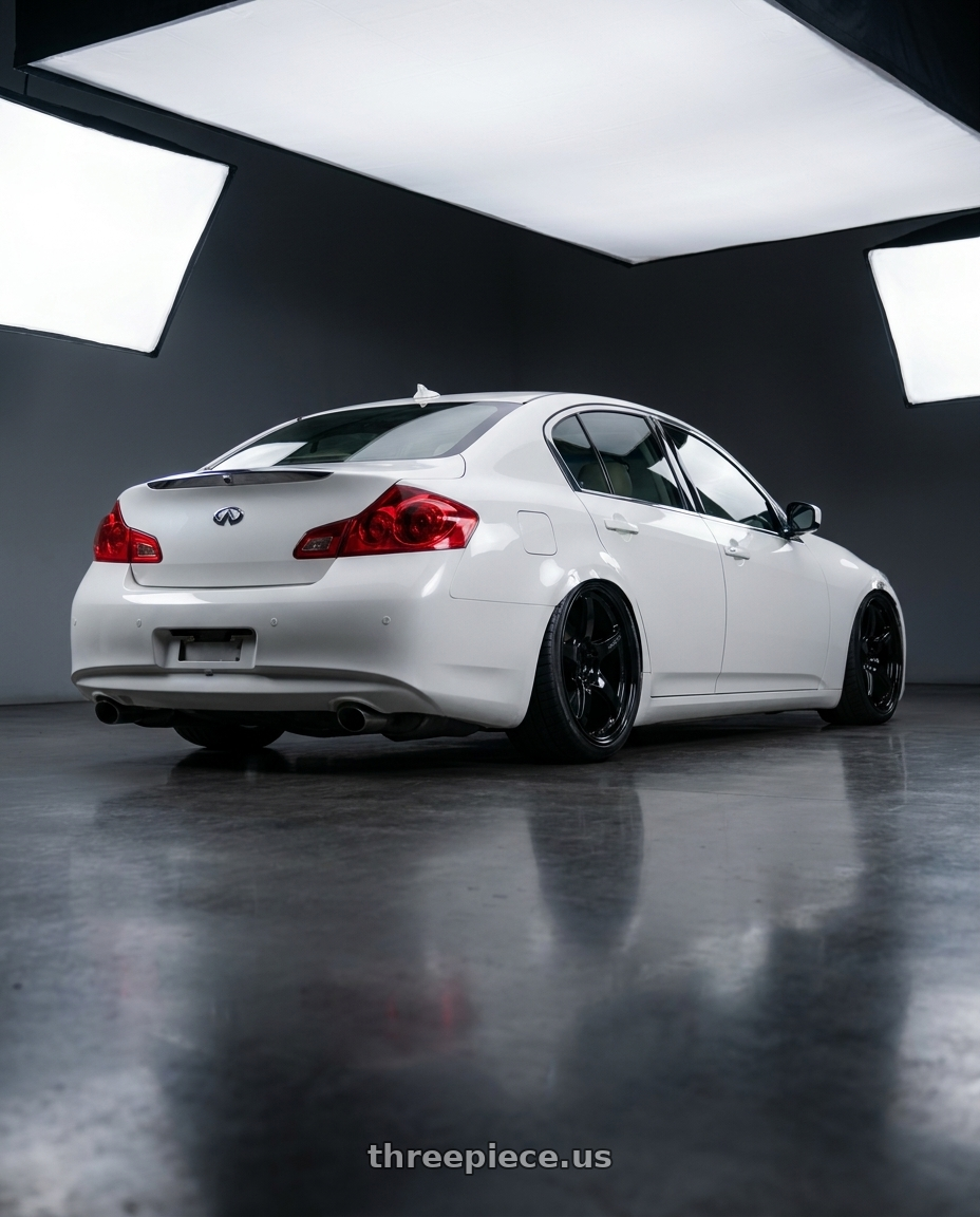 2012 Infiniti G37 with Gram Lights 57CR 5x114.3 19x9.5+25 Glossy Black wheels rear three quarter view slight stretch tires