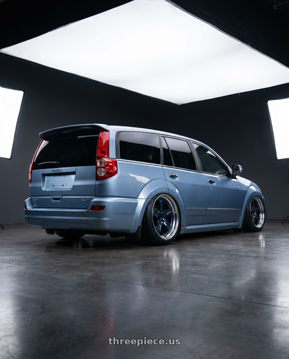 2004 Isuzu Axiom with Volk Racing 21C 5x114.3 18x10.5 +15 MAG BLUE / RIM DC wheels rear three quarter view slight stretch tires