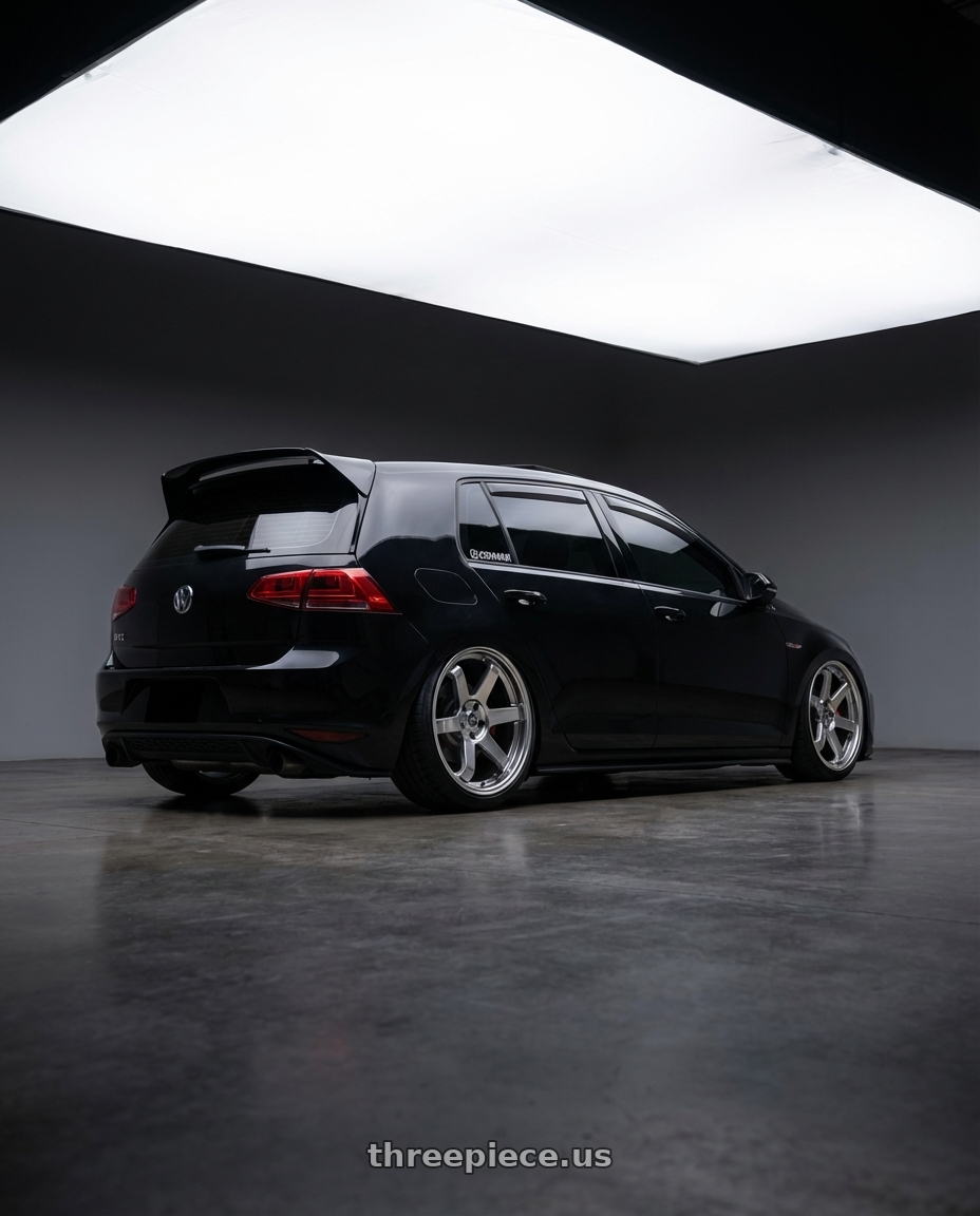 2016 Volkswagen Gti with F1R F106 5x114.3 18x9.5 +22 Hyper Black wheels rear three quarter view extreme stretch tires