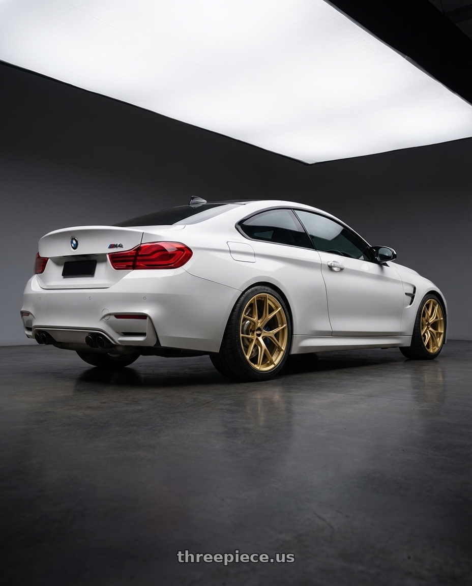 2018 BMW M4 F82 with BBS FI-R 5x120 19x9.5+22 Gold wheels rear three quarter view square tires