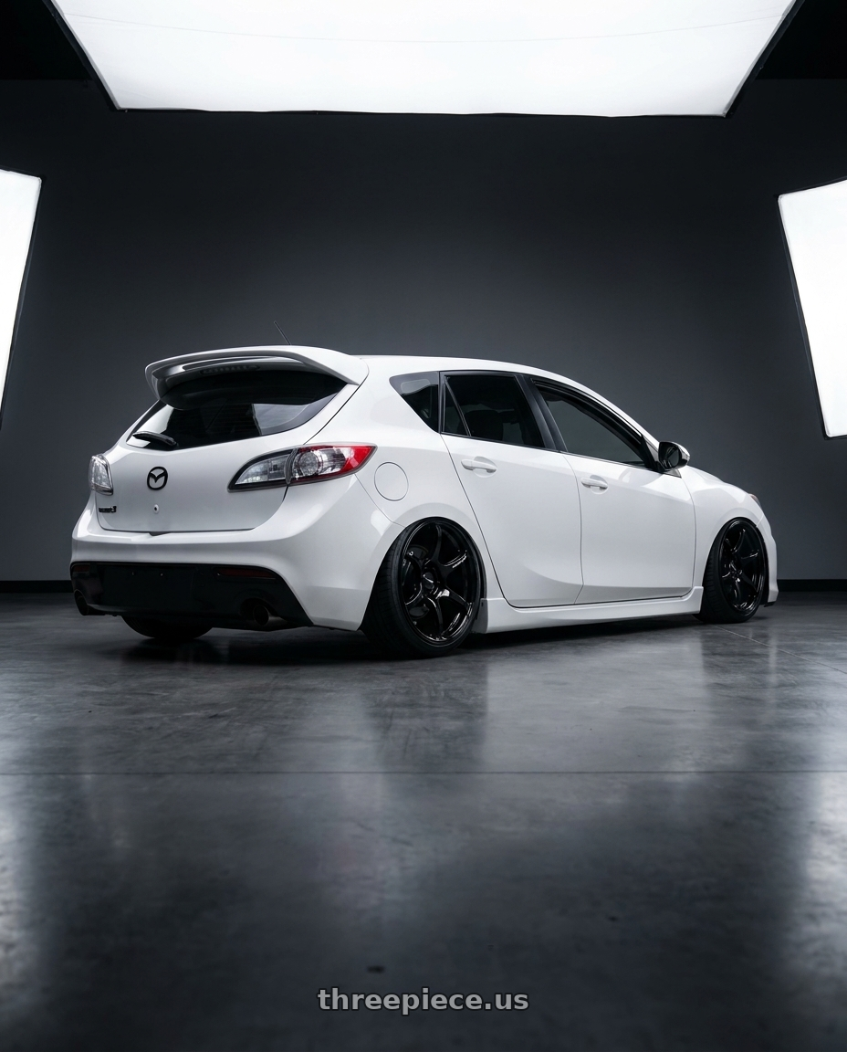 2012 Mazda Mazdaspeed3 with Advan RGIII 5x114.3 18x10.5+15 Gloss Black wheels rear three quarter view slight stretch tires