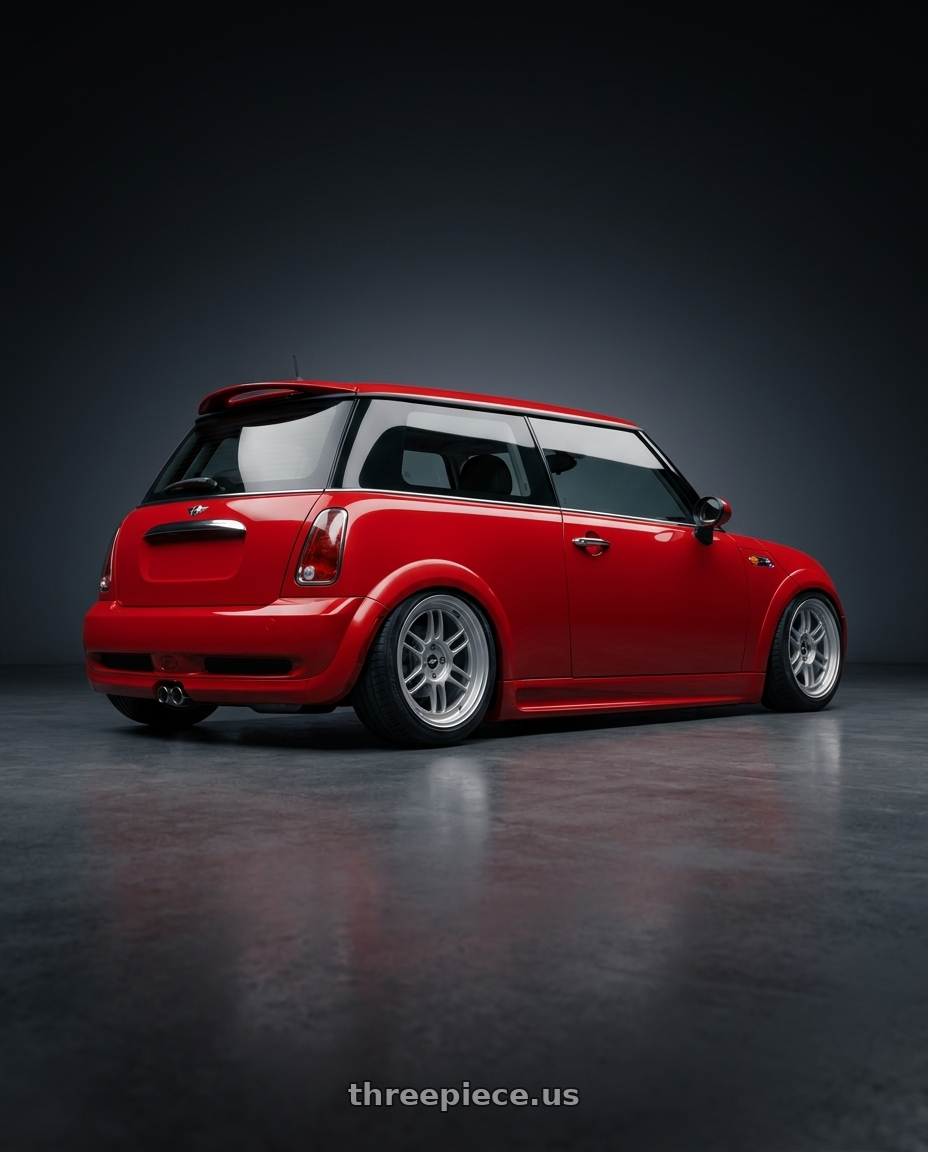 2004 Mini r50 with Enkei RPF1 4x100 16x8+38 Silver wheels rear three quarter view slight stretch tires