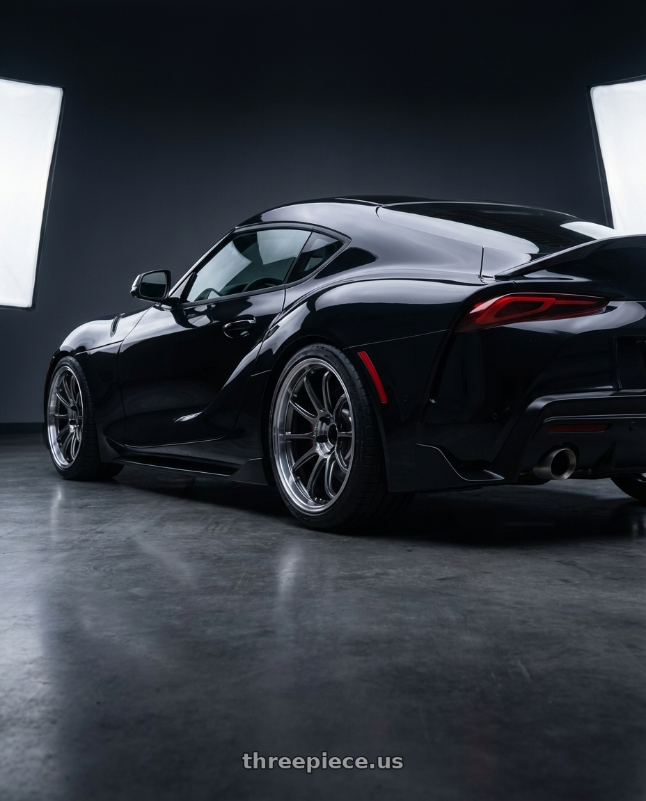 2026 toyota Supra final edition nocturnal black  with Advan Racing RZ-DF2 5x112 19x10.5 +32 DIAMOND CUT & HYPER PLATINUM BLACK wheels rear three quarter view square tires