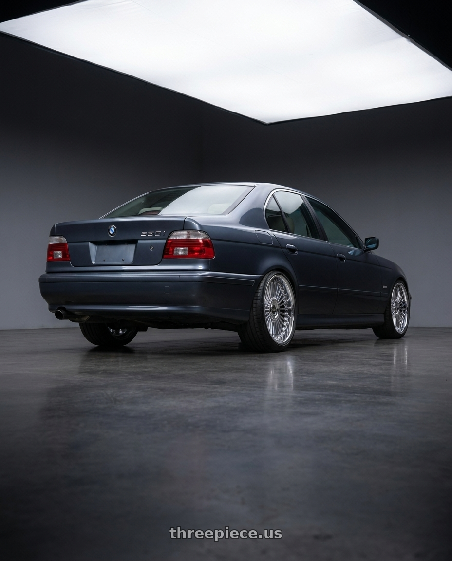 2002 bmw 530i with Work Emitz wheels rear three quarter view slight stretch tires