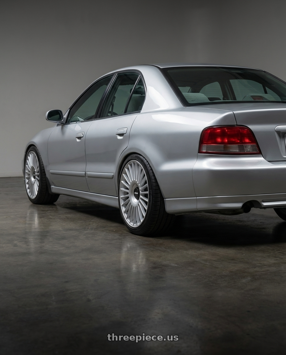 2001 mitsubishi galant with Rotiform RC202 GRZ 5X112/5X120 22x11.5 +40 GLOSS SILVER wheels rear three quarter view square tires