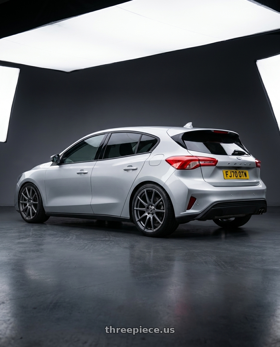 2020 ford focus with Forgestar CF10 5x120.65 20x12 +50 Gloss Anthracite wheels rear three quarter view square tires