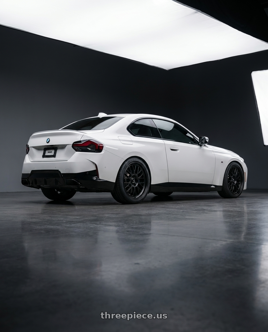 2024 BMW 2 Series G42 with fifteen52 HOLESHOT 5x112 19x8.5 +45 ASPHALT BLACK (SATIN BLACK) wheels rear three quarter view square tires