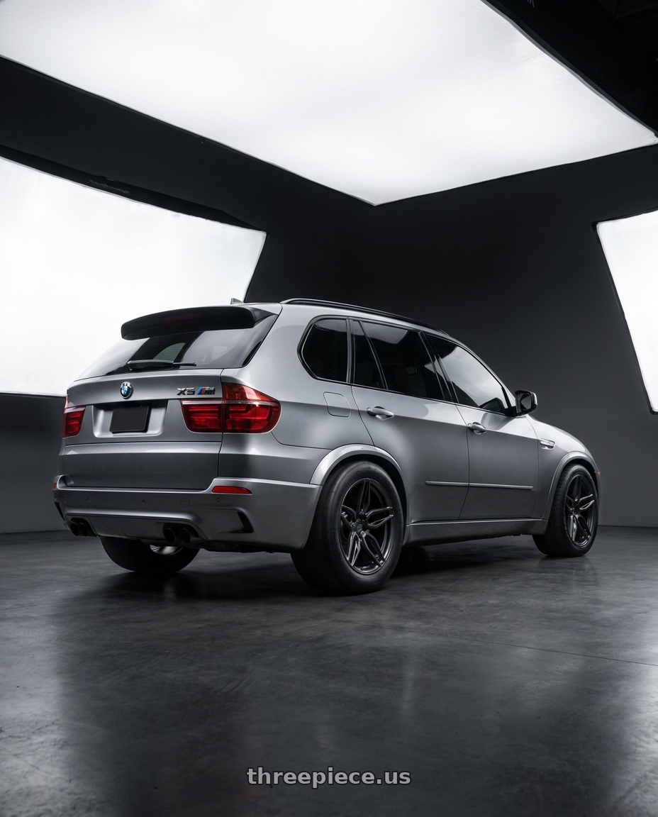 2013 BMW X5M with ADV.1 ADV005 5x120 21x12 +52 Satin Black wheels rear three quarter view excessive tires