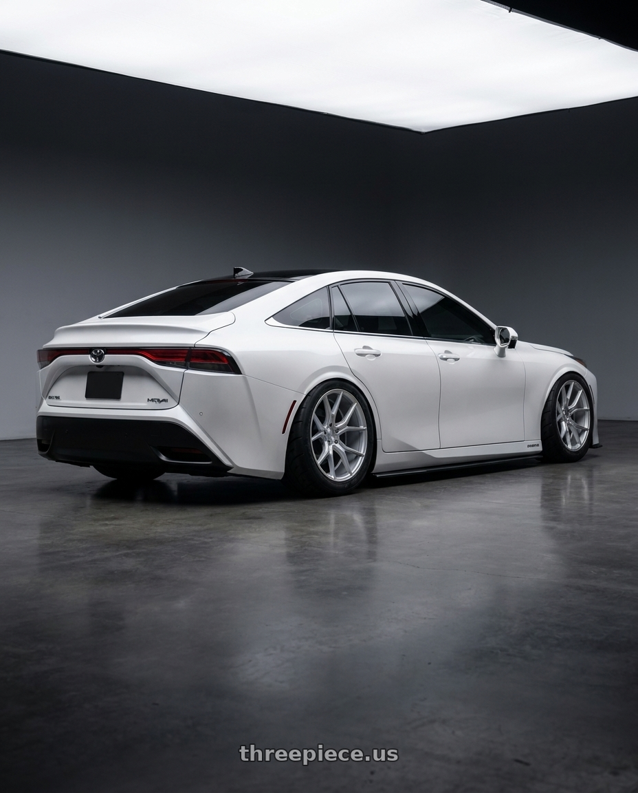 2021 Toyota mirai with DOLCE PERFORMANCE ELEMENT 5x120 19x9.5 +40 Gloss Silver Machined Face wheels rear three quarter view meaty tires