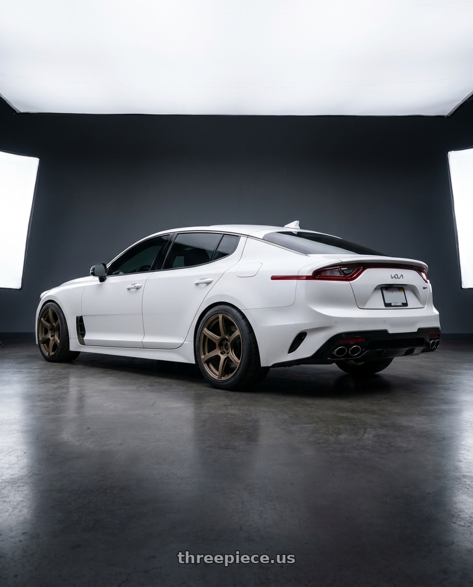 2023 Kia Stinger GT2 with Work Emotion T7r 5x114.3 19x9.5 +38 Matte Bronze wheels rear three quarter view meaty tires