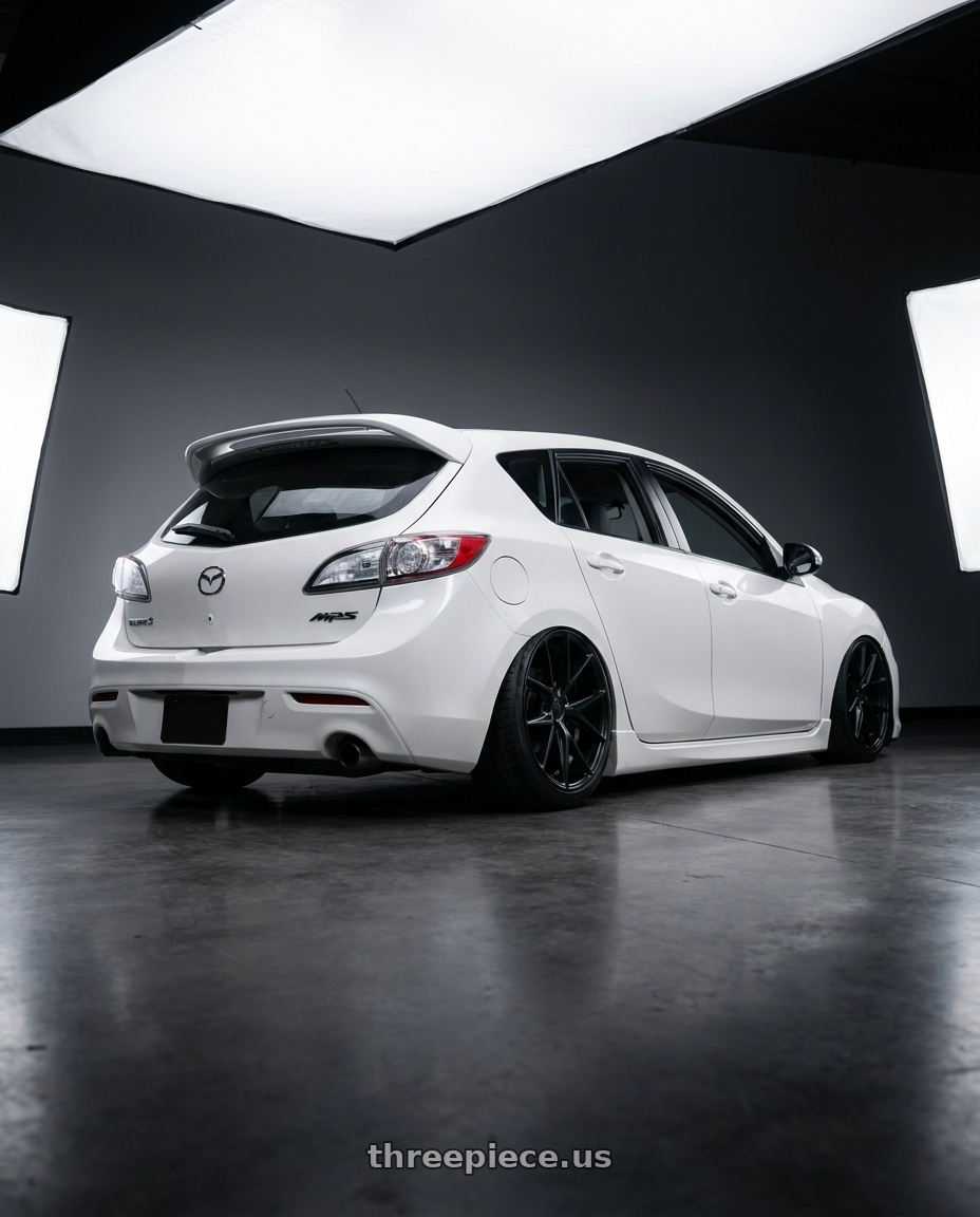 2012 Mazda Mazdaspeed3 with Niche 1PC M117 MISANO 5X114.3 18X8 +42 MATTE BLACK wheels rear three quarter view slight stretch tires