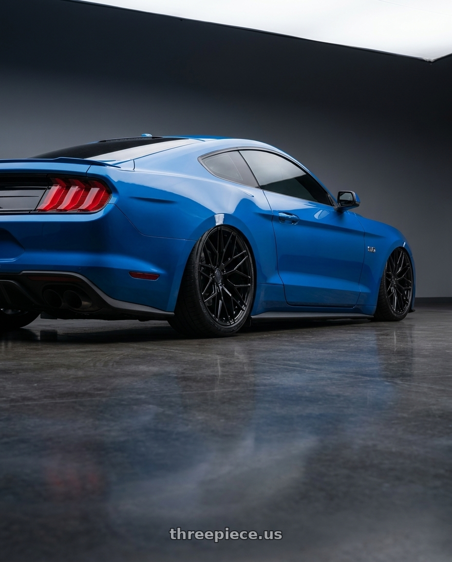 2022 Ford Mustang GT with Avant Garde Wheels M520R 5X114.3 19x9.5 +40 Gloss Black wheels rear three quarter view slight stretch tires