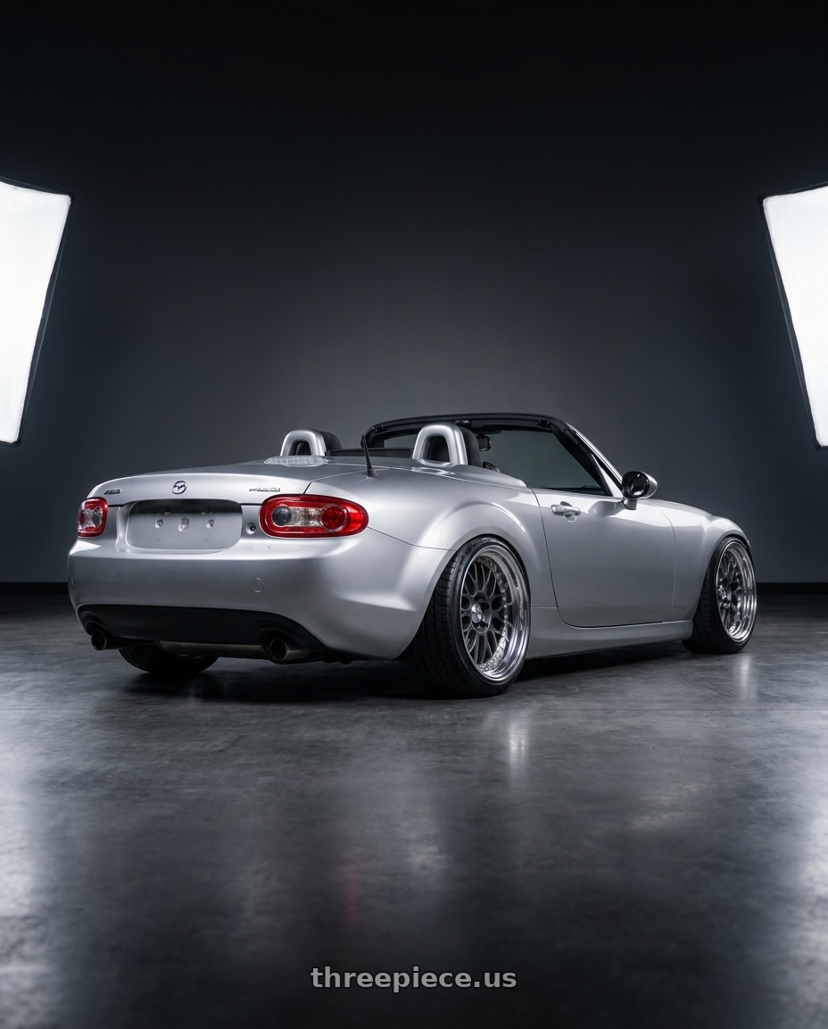 2007 Mazda Miata with Work Meister M1 3p 4x100 18x10.5+30 A Disk Matte Gunmetal wheels rear three quarter view extreme stretch tires