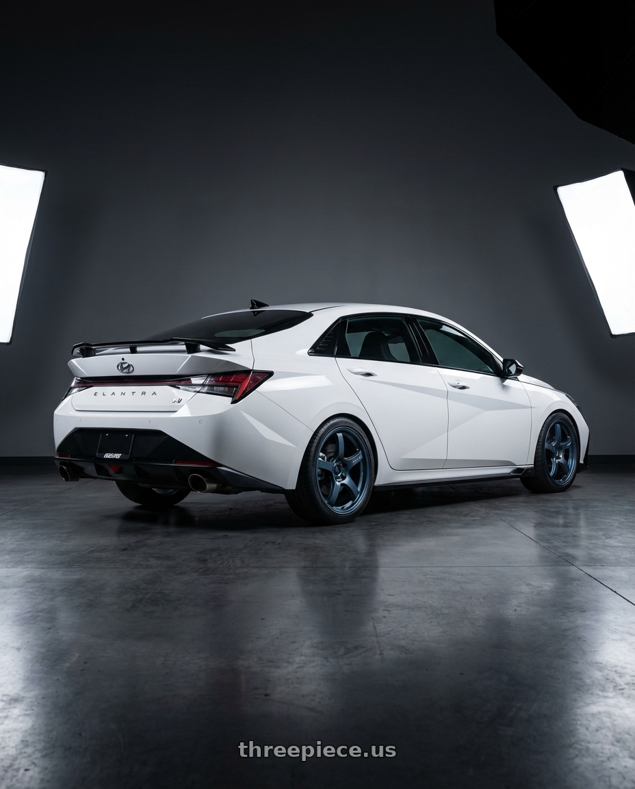 2024 Hyundai Elantra N with Gram Lights 57CR 5x114.3 19x9.5+45 Gunblue II wheels rear three quarter view square tires