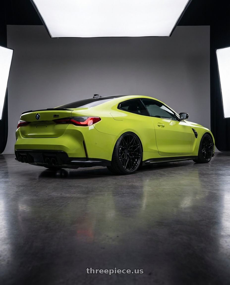 2024 BMW M4 G82 with Avant Garde Wheels M520R 5X112 19x8.5 +35 Gloss Black wheels rear three quarter view slight stretch tires