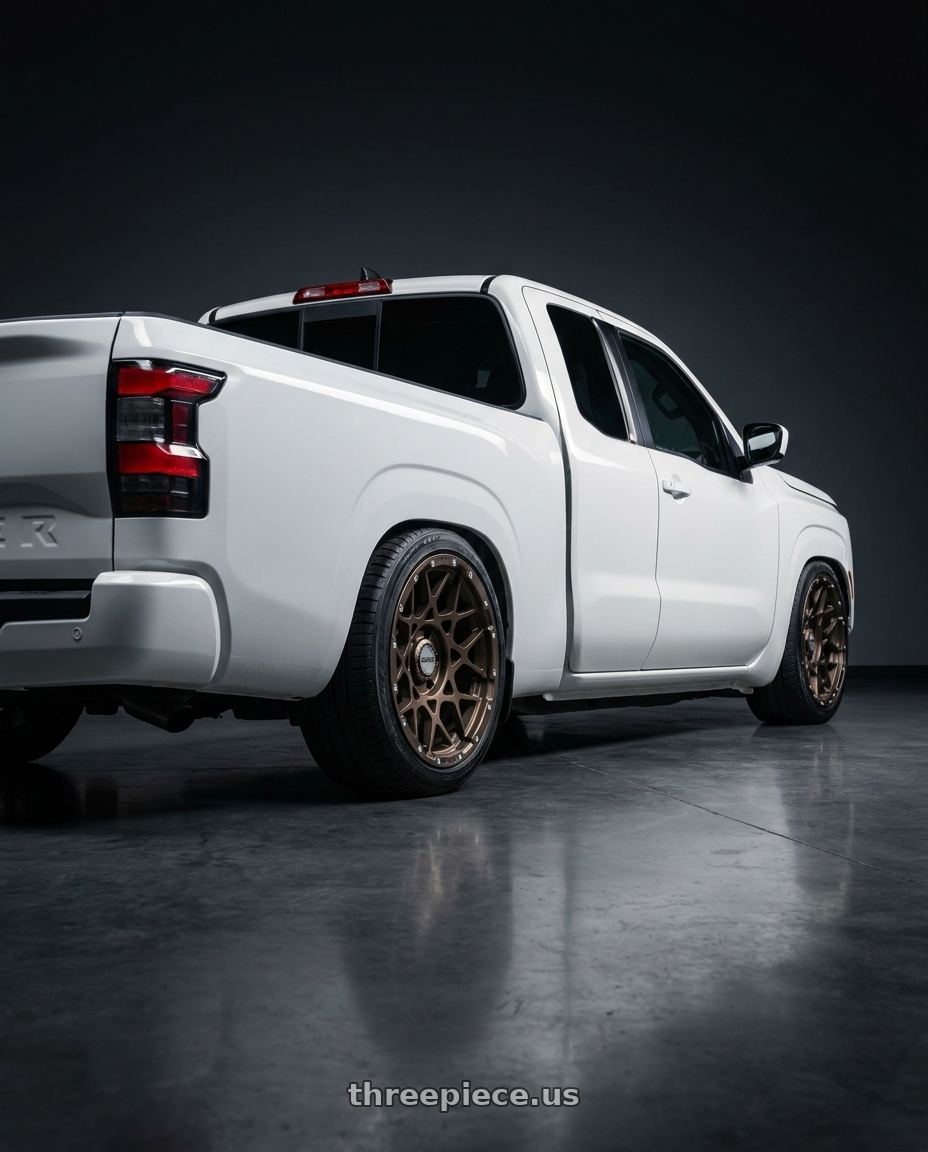 2025 nissan frontier king cab with Volk Racing RAYS M8 6x139.7 17x8.5 +0 DARK BRONZE wheels rear three quarter view slight stretch tires