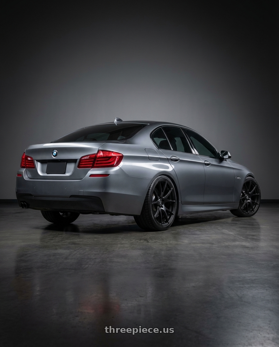 2016 BMW 5 Series F10 with Forgestar CF5V 5x120 19x9 +38 Satin Black wheels rear three quarter view square tires