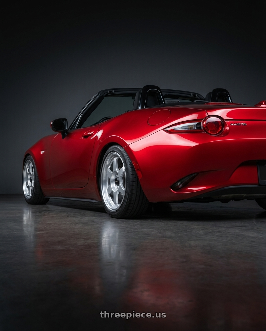 2016 Mazda Miata with Vors SP1 4x100/4x114.3 16x7  +38 Silver Machine Face Lip wheels rear three quarter view square tires