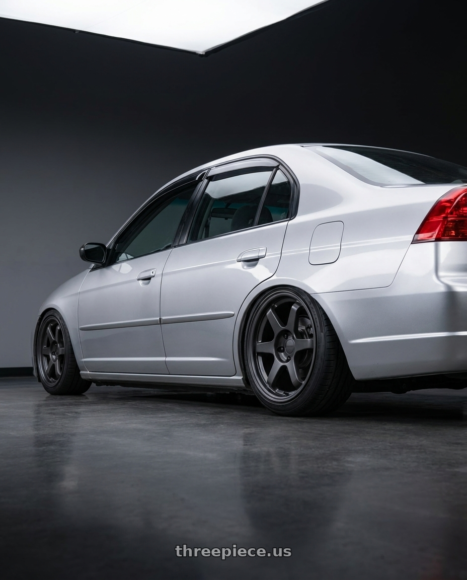 2002 Honda civic with 9six9 SIX-1 5x114.3 17X8 +35 Carbon Gray wheels rear three quarter view slight stretch tires