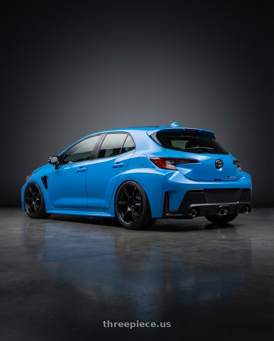 2024 Toyota GR Corolla with Advan RGIII 5x114.3 18x10.5+25 Gloss Black wheels rear three quarter view slight stretch tires