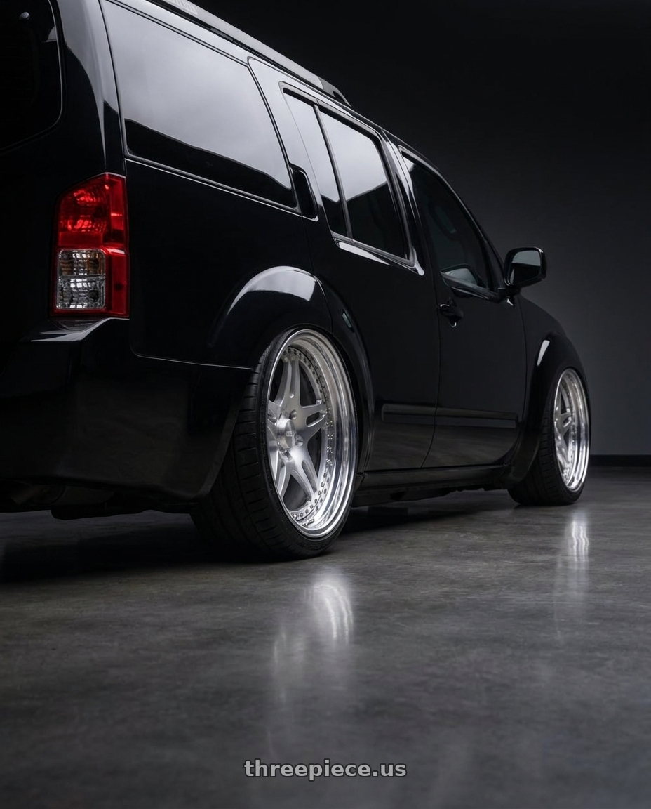 2011 Nissan Pathfinder Black with CCW SA52 6x114.3 16x7 +38 Polished wheels rear three quarter view square tires