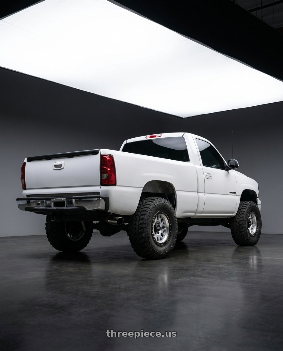 2000 Chevy Silverado 1500 with KMC KM549 GRS 6X139.7 17X9 -12 MACHINED WITH SATIN BLACK LIP wheels rear three quarter view square tires