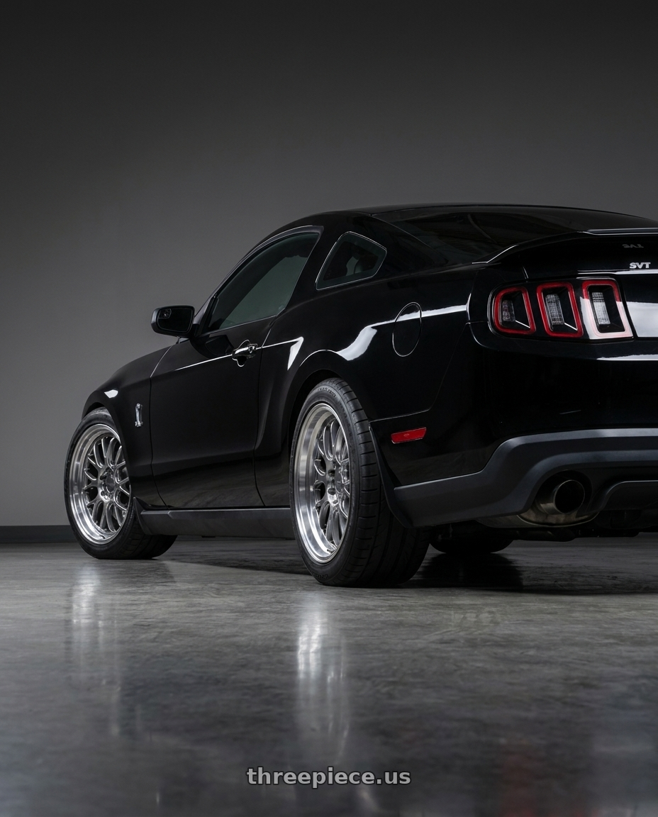 2011 GT500 SVT Performance Package Black with F1R F21 5x114.3/5x120 19x9.5 +35 Hyper Black/Polish Lip wheels rear three quarter view square tires