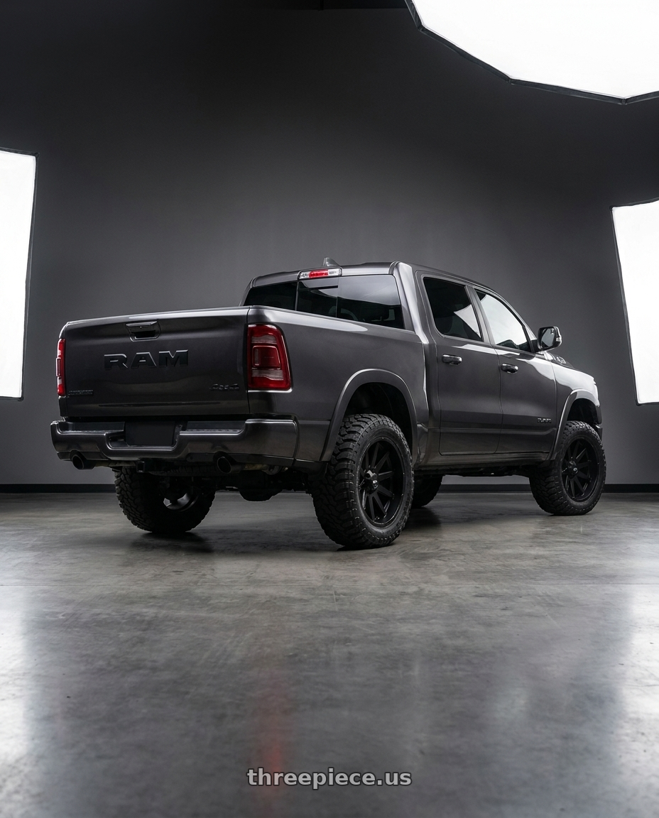 2021 Ram 1500 Laramie with Ion Type 143 6x139.7 20x10-19 Matte Black wheels rear three quarter view square tires