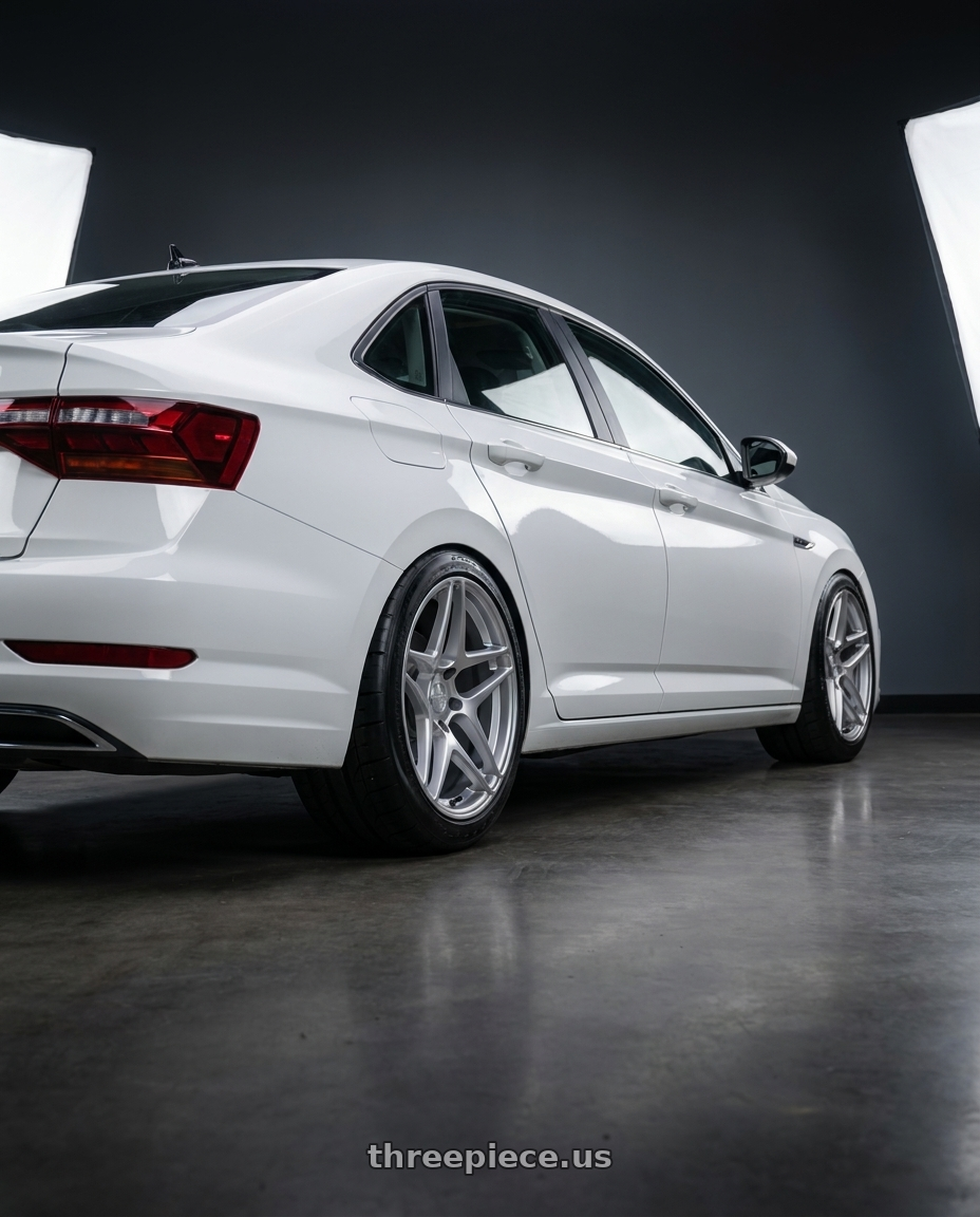 2026 volkswagen jetta with Kansei K15H Astro 5x114.3 18x9.5 22 Hyper Silver wheels rear three quarter view meaty tires