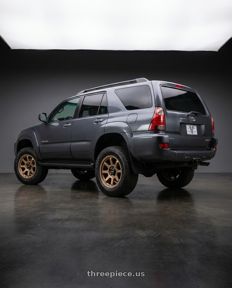 2007 toyota 4runner with Vision Off-Road 351 Flow 6x139.7 16x8+0 Bronze wheels rear three quarter view square tires