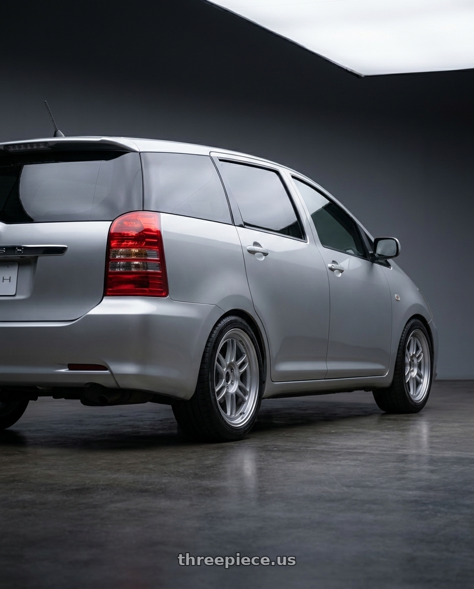 2005 Toyota Wish with Enkei RPF1 4x100 15x7+41 Silver wheels rear three quarter view square tires