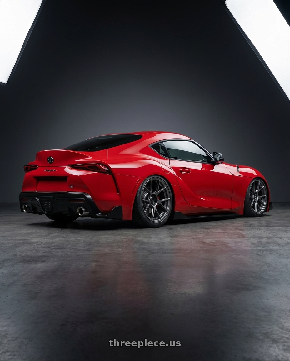 2023 Toyota GR Supra with Konig Ampliform 5x112 19x8.5+32 Dark Metallic Graphite wheels rear three quarter view slight stretch tires